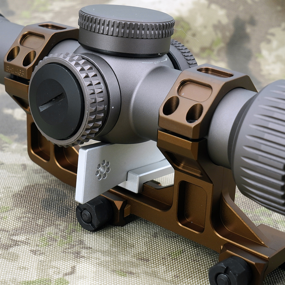 The Arisaka Optic Leveler is an inexpensive, easy-to-use tool for leveling scopes mounted in rings or one-piece mounts. The base plate sits on the Picatinny rail or one-piece mount just below the turret cluster of the scope, and then the matching wedge is inserted from the side. As the 11 degree ramped surfaces of the wedge and base engage, the top of the wedge rises upwards and contacts the turret cluster, automatically leveling it.  This product includes the leveler base and both small and large wedges.  The small wedge requires a space between the rail/mount and turret cluster from 0.190" to 0.730".  The large wedge requires a space between the rail/mount and turret cluster from 0.680" to 1.200".  Please note: some one-piece scope mounts like those made by Bobro may not have enough space, so be certain to check with your specific scope and mount. The leveler requires a flat surface directly below the turret cluster to function.  Directions for use:  1. Place scope in rings or one-piece mount. Tighten rings to remove slack, but leave loose enough that the scope can still be rotated by hand.  2. Place the leveler base on the Picatinny rail or one-piece mount directly below the turret cluster of the scope. The angled slot should be on the top side.  3. Insert the leveler wedge into the slot on the base from the side until it contacts the bottom of the turret cluster.  4. Gently apply pressure to the wedge until the scope rotates and is leveled.  5. Tighten one scope ring according to the torque specifications provided by the ring/mount manufacturer.  6. Remove the optic leveler.  7. Tighten the other ring according to the torque specifications provided by the ring/mount manufacturer.  Use of the Arisaka Optic Leveler makes the assumption that the scope's turret cluster and reticle are aligned, which may not be the case with poor quality scopes.  Material: 6061-T6 clear anodized aluminum.